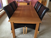 Dining room table solid oak & 6 black leather chairs