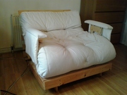 A lovely single wooden Futon for sale